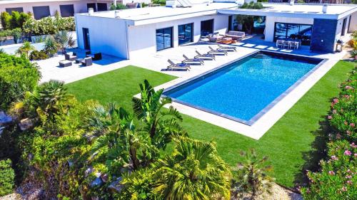 an aerial view of a house with a swimming pool at Blue Hill Boutique Villa by Junto ao Mar in Quelfes
