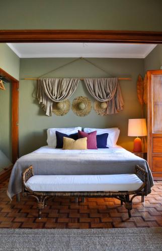 a bedroom with a large bed in a room at Chic Suite Figueiras w balcony in Taviras Historical Centre in Tavira