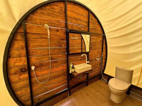 a bathroom with a toilet and a sink in a dome at VietGangz TaNoYa Glamping in Bình Thành (2)