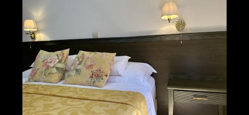 a bedroom with a bed with two pillows at Charming apartment with a terrace in Kotor