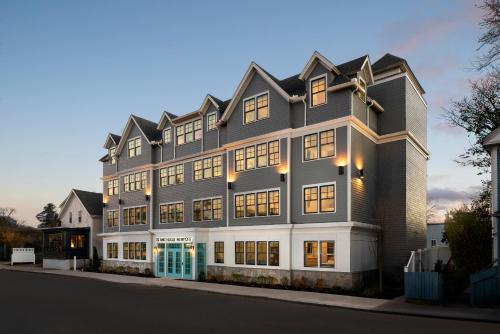 a large building on the side of a street at Island House Newport in Newport