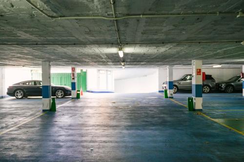 a parking garage with cars parked in it at Gran Hotel Victoria in Santander