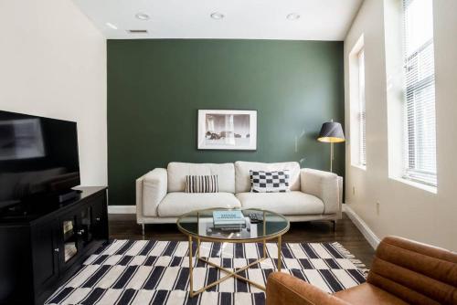 a living room with a couch and a table at Delightful North End Apt 2BR 2BA Laundry in Boston