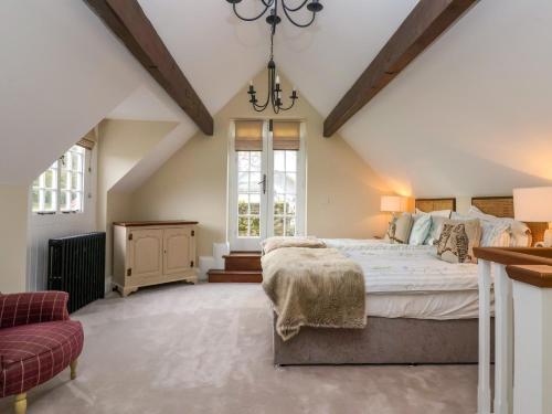 a bedroom with a large bed and a window at The Bothy in Knaresborough
