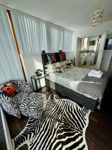a bedroom with a zebra patterned bed at James Clow Bed & Breakfast in Belfast