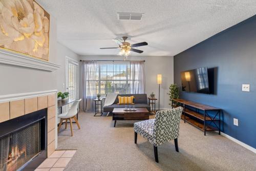 a living room with a couch and a fireplace at Cozy 2BR Athens Retreat Near UGA and Downtown in Athens