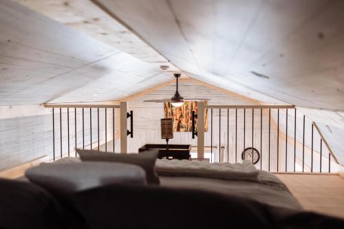 a living room with a couch and a ceiling at Quiet Country Cabin in Waiparous Village