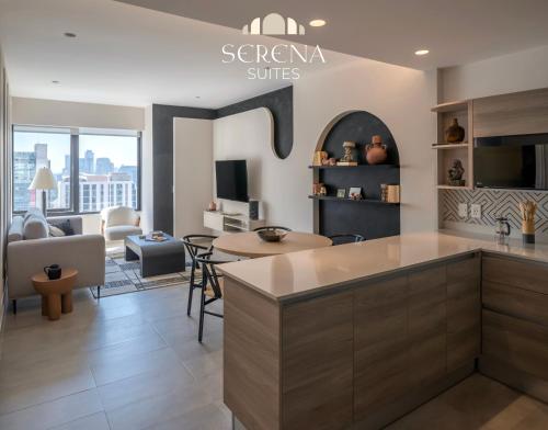 a kitchen and living room with a couch and a table at Elegant Condo with Air Conditioning, Pool, Sauna, & Fitness Center in Polanco in Mexico City