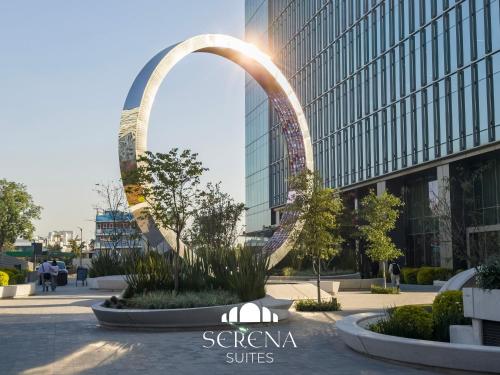 a sculpture of the gateway arch in front of a building at Elegant Condo with Air Conditioning, Pool, Sauna, & Fitness Center in Polanco in Mexico City