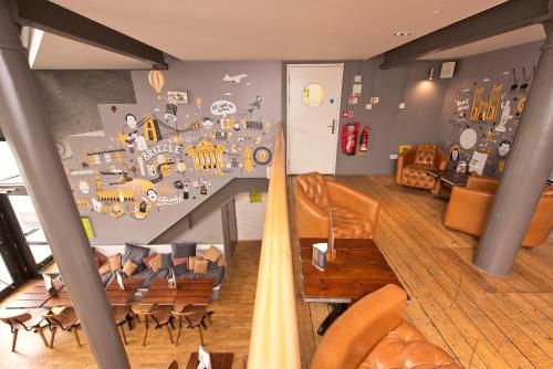 a living room with a table and chairs and a room with at YHA Bristol in Bristol