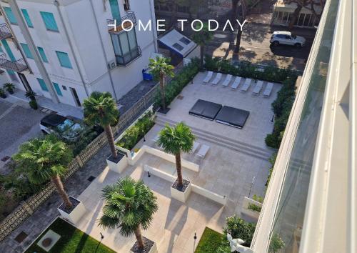 an overhead view of a building with palm trees at HT - Luxury apartment at Palm Beach Jesolo in Lido di Jesolo