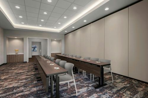 a conference room with a long table and chairs at SpringHill Suites by Marriott Chula Vista Eastlake in Chula Vista