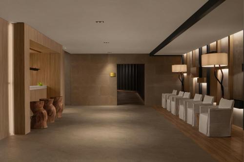 a hallway with a row of chairs in a building at Cappadocia Marriott Hotel in Nevsehir