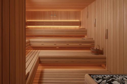 a sauna with wooden walls and wooden floors and stairs at Cappadocia Marriott Hotel in Nevsehir