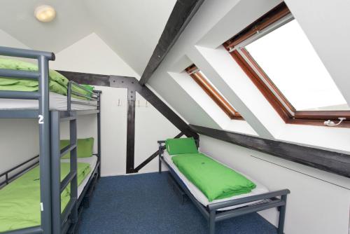 a room with two bunk beds and a window at YHA Bristol in Bristol