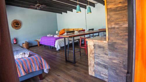a room with a table and a dining room at K10 Lodge in Curacautín