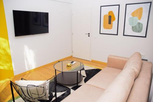 a living room with a couch and a table at Christians Haus in Târgu-Mureş