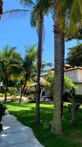 a group of palm trees in a park at Pousada Corsario Buzios in Búzios