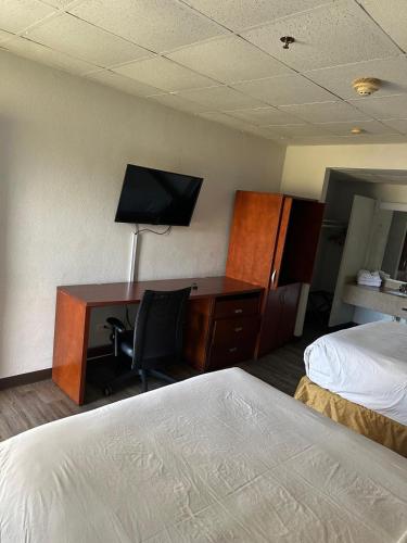 Ένα ή περισσότερα κρεβάτια σε δωμάτιο στο Park View Inn.