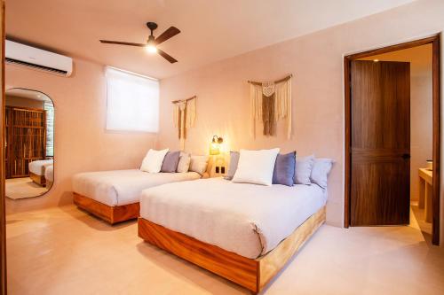 Ένα ή περισσότερα κρεβάτια σε δωμάτιο στο Marakame Suites