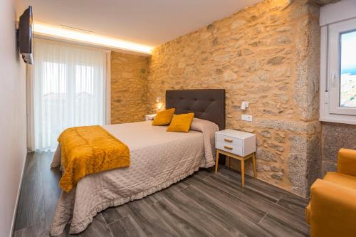 Posteľ alebo postele v izbe v ubytovaní Apartamentos Currás en Touriñán