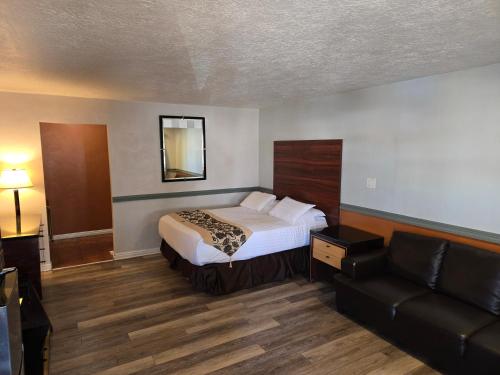 Postel nebo postele na pokoji v ubytování Sage Motel