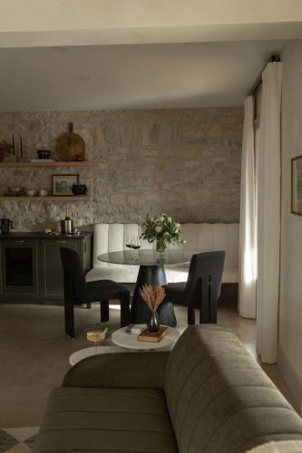 a living room with a couch and a table at Kat Florence Hotels in Elora