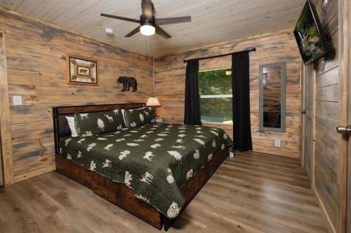 a bedroom with a bed and a ceiling fan at Newly renovated 2 BR in convenient location! in Sevierville