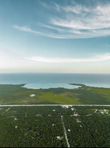 an aerial view of an island in the ocean at Jungle Villa Tulum in Balcheil