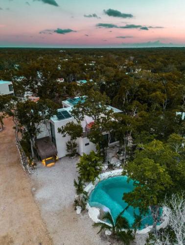 an aerial view of a resort with a swimming pool at Jungle Villa Tulum in Balcheil