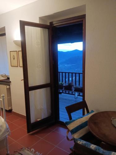 a door to a room with a view of a balcony at Villa Erbetta in Guardabosone