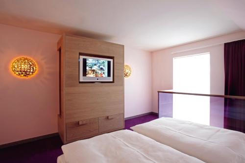 Cama o camas de una habitación en abito Suites