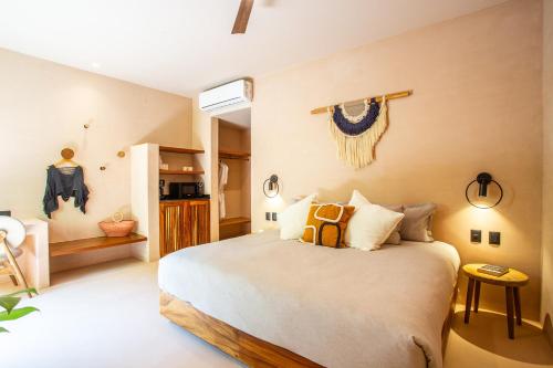 Ένα ή περισσότερα κρεβάτια σε δωμάτιο στο Marakame Suites