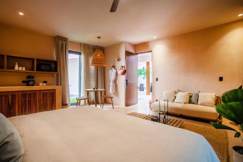 Ένα ή περισσότερα κρεβάτια σε δωμάτιο στο Marakame Suites