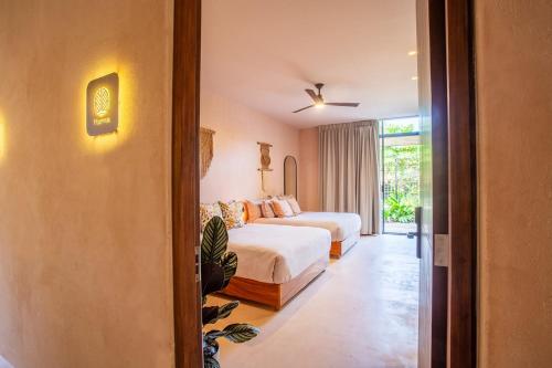Ένα ή περισσότερα κρεβάτια σε δωμάτιο στο Marakame Suites