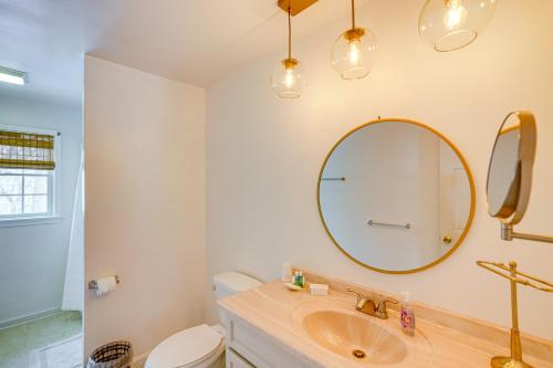 a bathroom with a sink and a mirror at Walk to Dining Downtown Lenox Guest House! in Lenox
