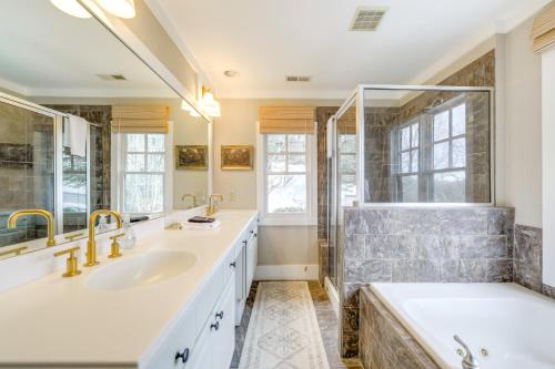 a bathroom with two sinks and a large tub at Incredible Lake Glenville Views Cashiers Home in Cashiers