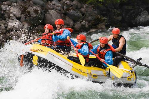 a group of people in a raft on a river at Cozy Ski Chalet in the Heart of the Poconos in Tobyhanna