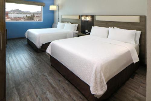 Postel nebo postele na pokoji v ubytování Holiday Inn Express Manzanillo by IHG
