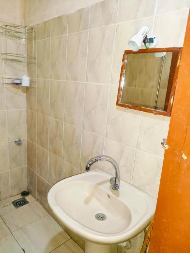 a bathroom with a sink and a mirror at Sunset Mirage in Luxor