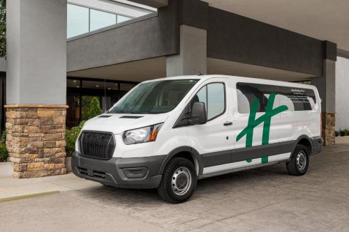 a white van parked in front of a building at Holiday Inn Nashville Downtown - Stadium by IHG in Nashville