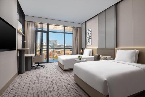 Katil atau katil-katil dalam bilik di Crowne Plaza Quzhou, an IHG Hotel