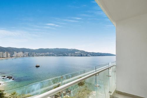 a view of the water from a balcony of a building at Fiesta Americana Acapulco Villas in Acapulco
