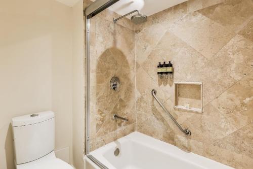 a bathroom with a shower and a toilet at Fiesta Americana Acapulco Villas in Acapulco