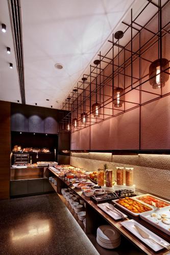 a buffet line with many different types of food at Olivia Plaza Hotel in Barcelona