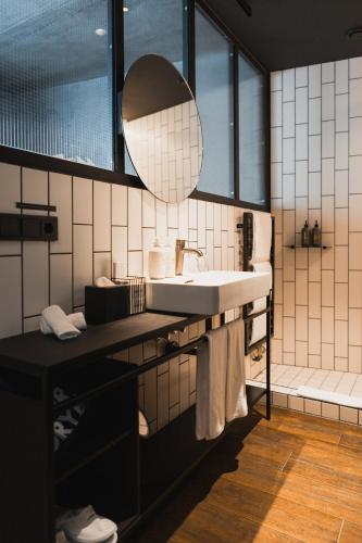 a bathroom with a sink and a mirror at Exeter Hotel in Reykjavík