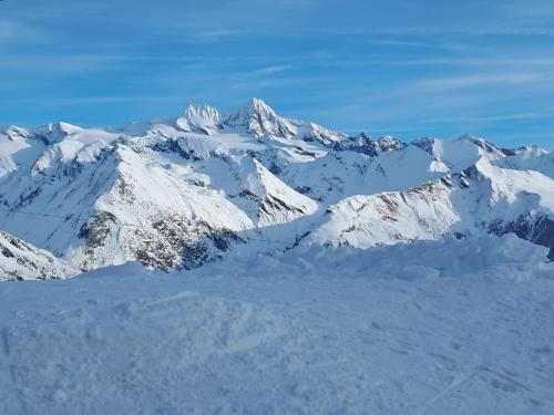 a mountain range with snow on it at Ferienhaus Enzian in Prägraten am Großvenediger