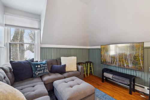 a living room with a couch and a table at Historic District BnB in Saint Paul