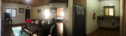 a living room with a couch and a table at Valley Breeze Resort in Gabaldon