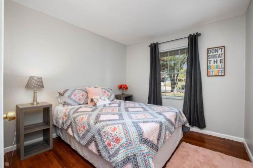 a bedroom with a bed and a window at Ashwood Arbor 3 bed 2 bath sleeps 8 in Olde West Chester